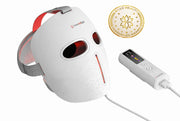 The MitoGLOW™ LED Red Light Therapy Mask by Mito Red Light features eye and mouth cutouts, connects to a handheld digital controller, and uses red, blue, yellow, and near-infrared LED light. Awarded the 2023 Beauty Innovation Award.