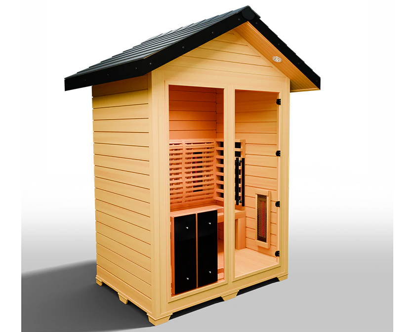 The Medical Saunas - Nature 6 Outdoor Infrared Sauna by Medical Saunas features a modern design with light wood panels, a slanted black roof, glass doors and windows, wooden benches, and a full spectrum infrared heating panel.