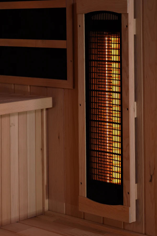 Golden Designs Reserve Edition GDI-8020-02 Full Spectrum Sauna with Himalayan Salt Bar in a wooden room, featuring hardwood walls and shelves.