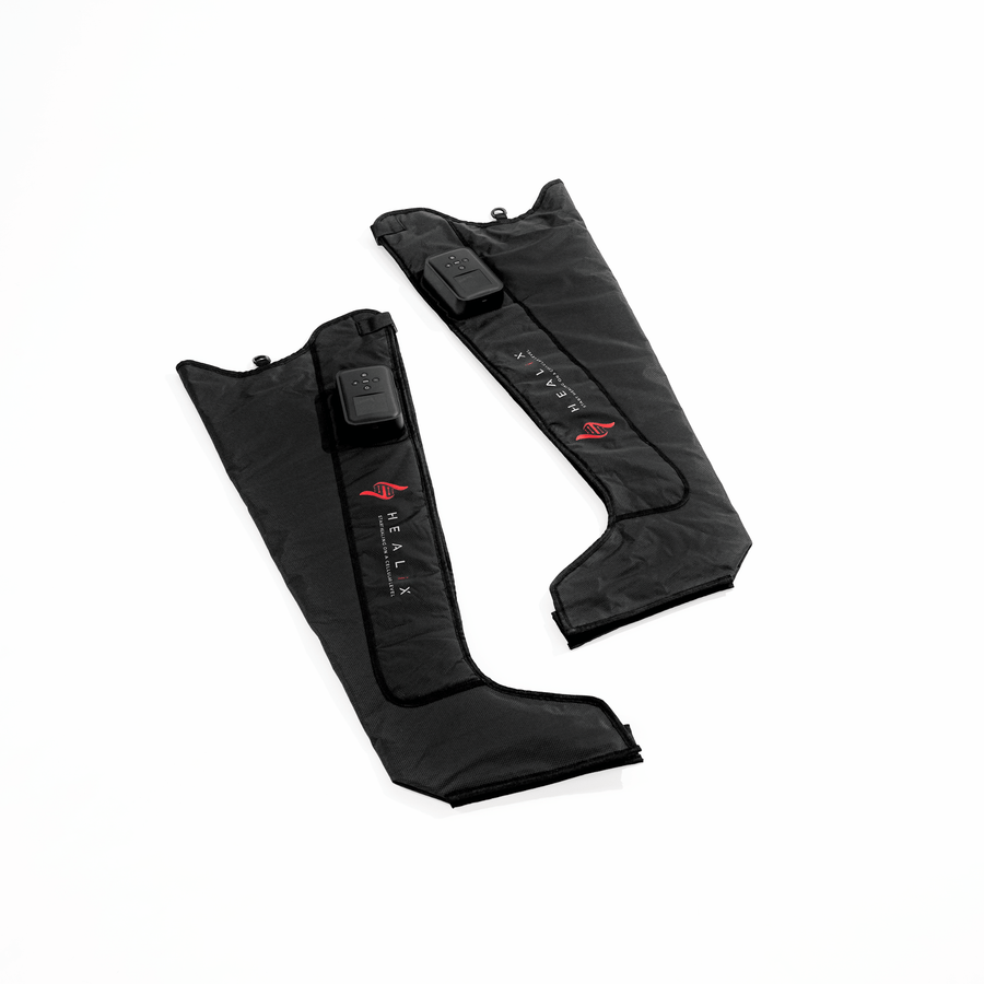 Two black HEALiX Flow leg compression sleeves with control units, featuring the HEALiX Infrared brand name and red logo, displayed on a white background.