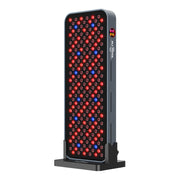 The RLT Home Total Spectrum COMPACT Red Light Therapy Panel by RLT Home is a rectangular device on a stand with red and blue LED bulbs and a side logo—ideal for supporting holistic health and mitochondrial function.