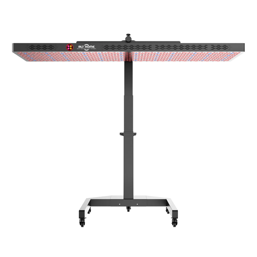 The RLT Home Total Spectrum ELITE Red Light Therapy Panel by RLT Home is a large, rectangular full-body device on a height-adjustable wheeled stand. It emits red and near-infrared light, includes SWIR LEDs, a central control knob, and has the logo on the front.