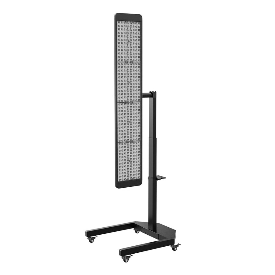 The RLT Home Total Spectrum ULTRA (7 Wave 480 LEDs) is a tall, rectangular red light therapy panel with a black frame on a wheeled, adjustable-height stand, ideal for medical or full-body wellness use.