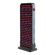 The RLT Home Total Spectrum COMPACT (7 Wave 216 LEDs) is a tall, rectangular red light therapy device with a front grid of red and blue LEDs and a side display to aid pain recovery.