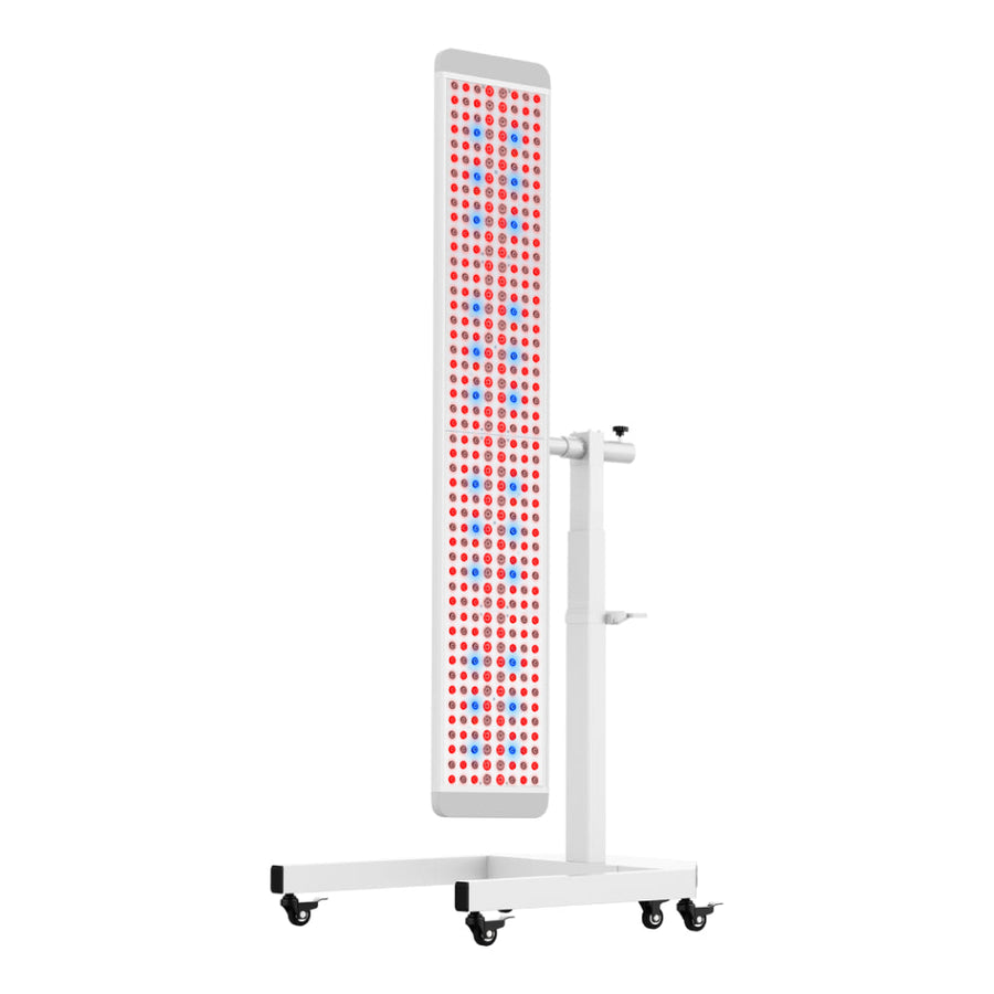 The RLT Home Total Spectrum ULTRA (7 Wave 480 LEDs) is a tall, rectangular red and near-infrared light therapy panel on a white wheeled stand with rows of red and blue LEDs for full-body wellness and pain relief.