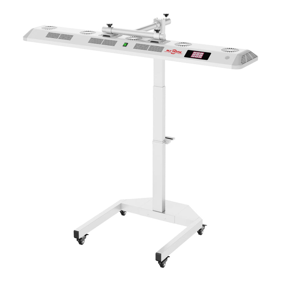The RLT Home Total Spectrum ULTRA (7 Wave 480 LEDs) is a white, rectangular red and infrared light therapy lamp on a height-adjustable stand with caster wheels, featuring control panel and vents for medical use, pain relief, and full-body wellness.