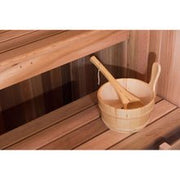 Wooden bucket and ladle inside Almost Heaven Bridgeport 6 Person Indoor Hybrid Sauna with multi-level benches.