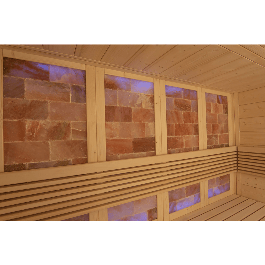 The Almost Heaven Himalaya 4 Person Indoor Sauna features rectangular salt brick walls illuminated by purple-blue backlighting and a slatted wooden bench—ideal for relaxing salt therapy. Brand: Almost Heaven.