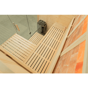 The Almost Heaven Himalaya 4 Person Indoor Sauna by Almost Heaven features wooden benches, a compact electric heater, a glass door, light wood walls, and reddish-orange Himalayan salt bricks for soothing salt therapy.