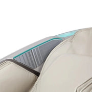 Close-up of the Osaki Ai series Apex Duo 5D+4D massage chair’s headrest with light beige upholstery, built-in gray speaker panel with horizontal vents, and teal trim.