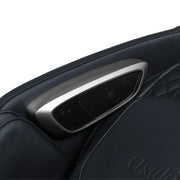 Close-up of a built-in speaker on the armrest of the Osaki 4D+3D Bravo Duo Flex massage chair, seamlessly integrated into its quilted, dark leather design and encased in a sleek metallic frame.