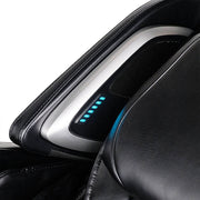 Close-up of the Daiwa Pegasus Hybrid Massage Chair by Daiwa, showcasing a silver control panel with six blue LED lights and a black mesh speaker, engineered for comprehensive full-body relaxation.