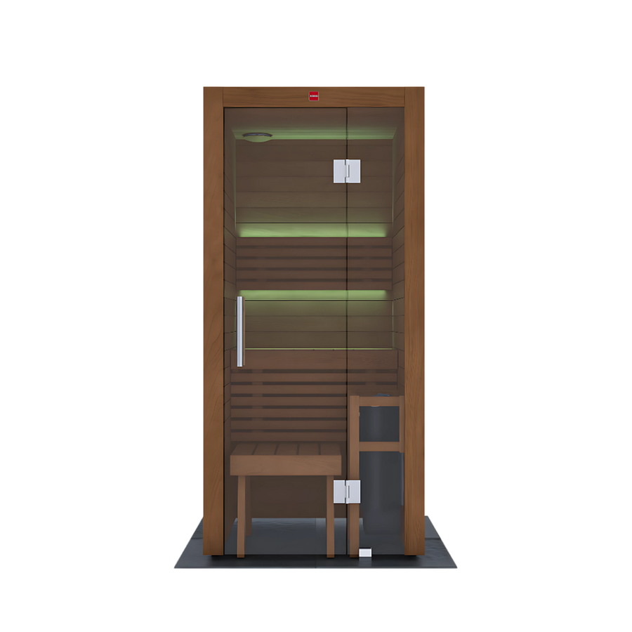 The LuxeWell Life Harvia Utu is a heat-treated Nordic spruce 1-person indoor sauna with a glass door, bench, stool, and green LED lighting—shown from the front against a plain white background.