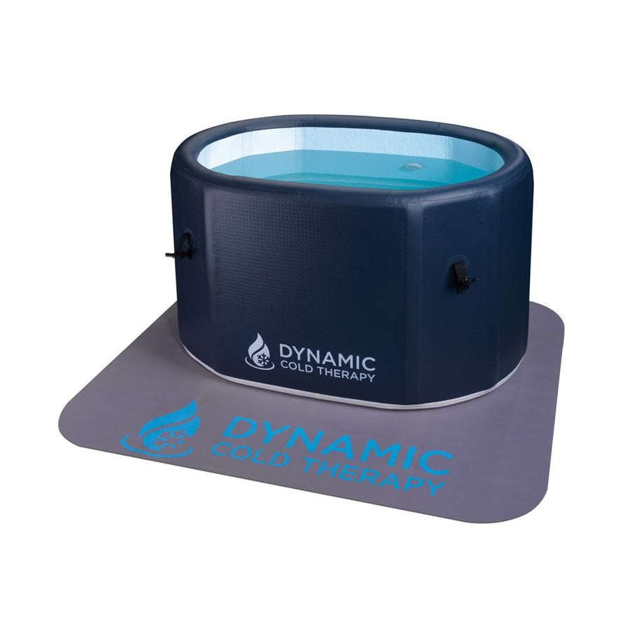 Dynamic Cold Therapy Inflatable Oval Cold Plunge tub on an anti-slip mat, designed for easy setup and muscle recovery. Includes manual pump and carry bag.