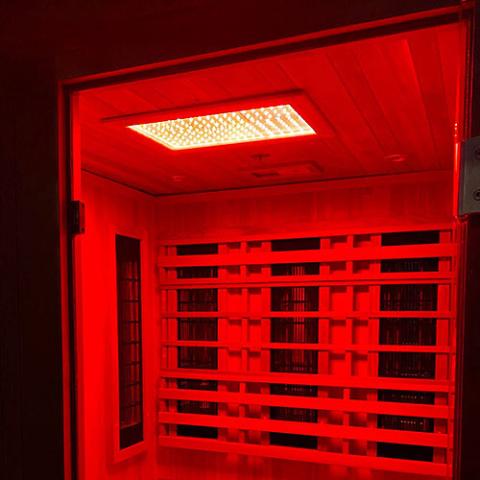 Finnmark FD-4 Trinity Infrared & Steam Sauna Combo featuring advanced infrared heaters and traditional steam capabilities, shown in an elegant indoor setting.