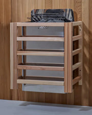Golden Designs Carinthia 3 Person Hybrid Outdoor Sauna in Canadian Hemlock on a wooden shelf with a white background.