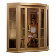 A woman in a white towel sitting in a Maxxus 3 Person Low EMF FAR Infrared Sauna Canadian Hemlock.