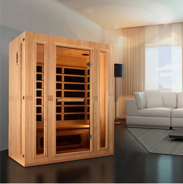 Maxxus Trinity Dual Tech 3-person Low EMF FAR Infrared Sauna with glass doors in a room, constructed of Canadian Hemlock.