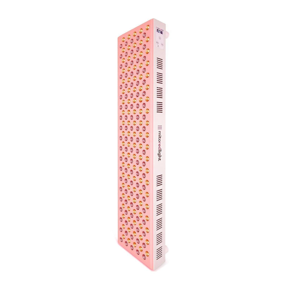 The Mito Red Light MitoMAX 2.0 is a tall, rectangular pink red light therapy panel featuring rows of small circular lights on the front and side ventilation slots, shown standing upright against a white background.