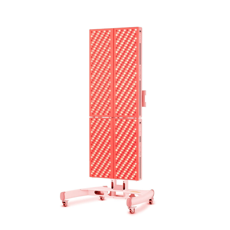 The MitoPRO+ | Red Light Therapy Panel Series v2 by Mito Red Light features a tall, rectangular panel with four quad-wavelength LED sections on a wheeled, adjustable stand, emitting therapeutic red and near-infrared light.