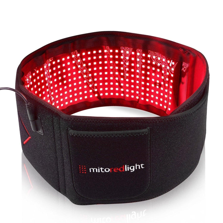 The MitoQUAD™ Wavelength Belt by Mito Red Light is a black red light therapy belt with glowing red LED panels, a velcro strap, and the brand name displayed on the front pocket. It uses medical grade red light therapy for hands-free use.