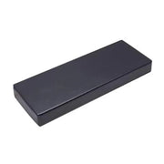 A rectangular, closed black Finnmark Sauna Cushion for FD-2, made from marine grade vinyl with smooth edges by Finnmark, is viewed from an angle against a plain white background.