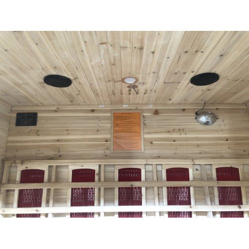 SunRay Cayenne 4-Person Outdoor Sauna 400D in natural Canadian hemlock wood with a shingled roof and recessed interior lighting, designed for outdoor use.