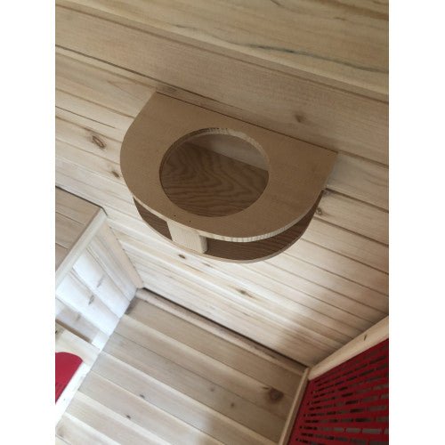 SunRay Cayenne 4-Person Outdoor Sauna 400D with ceramic heaters, natural Canadian hemlock wood, and a shingled roof in a wooden room.