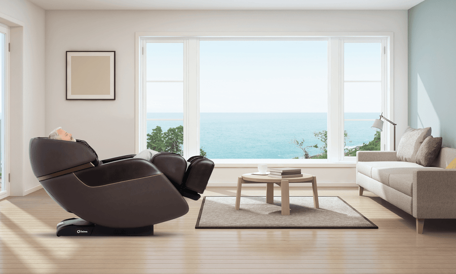 Daiwa Legacy 4 Massage Chair in a modern living room with a view of the ocean, featuring advanced massage functions and a space-saving design.