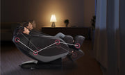 A woman relaxing in the Daiwa Orbit 3D Massage Chair, which offers advanced features like zero-gravity positioning and a full-body massage track.
