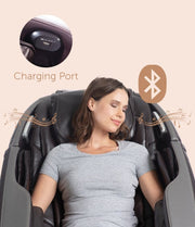 A woman sleeping in a Daiwa Orbit 3D Massage Chair, featuring a USB port and advanced full-body massage capabilities.