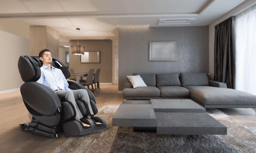A man relaxes in a Daiwa Relax 2 Zero 3D Massage Chair in a living room.