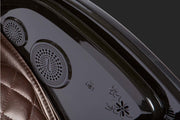 Close-up of the Kyota Kokoro M888 Massage Chair's Bluetooth speaker on a leather surface, highlighting its premium materials and advanced features.