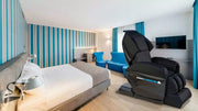 Medical Breakthrough 6 Plus massage chair in a hotel room, showcasing its advanced features for posture correction, pain relief, and sleep enhancement.