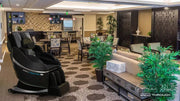 Medical Breakthrough 8 Plus massage chair in a modern room with plants and furniture.